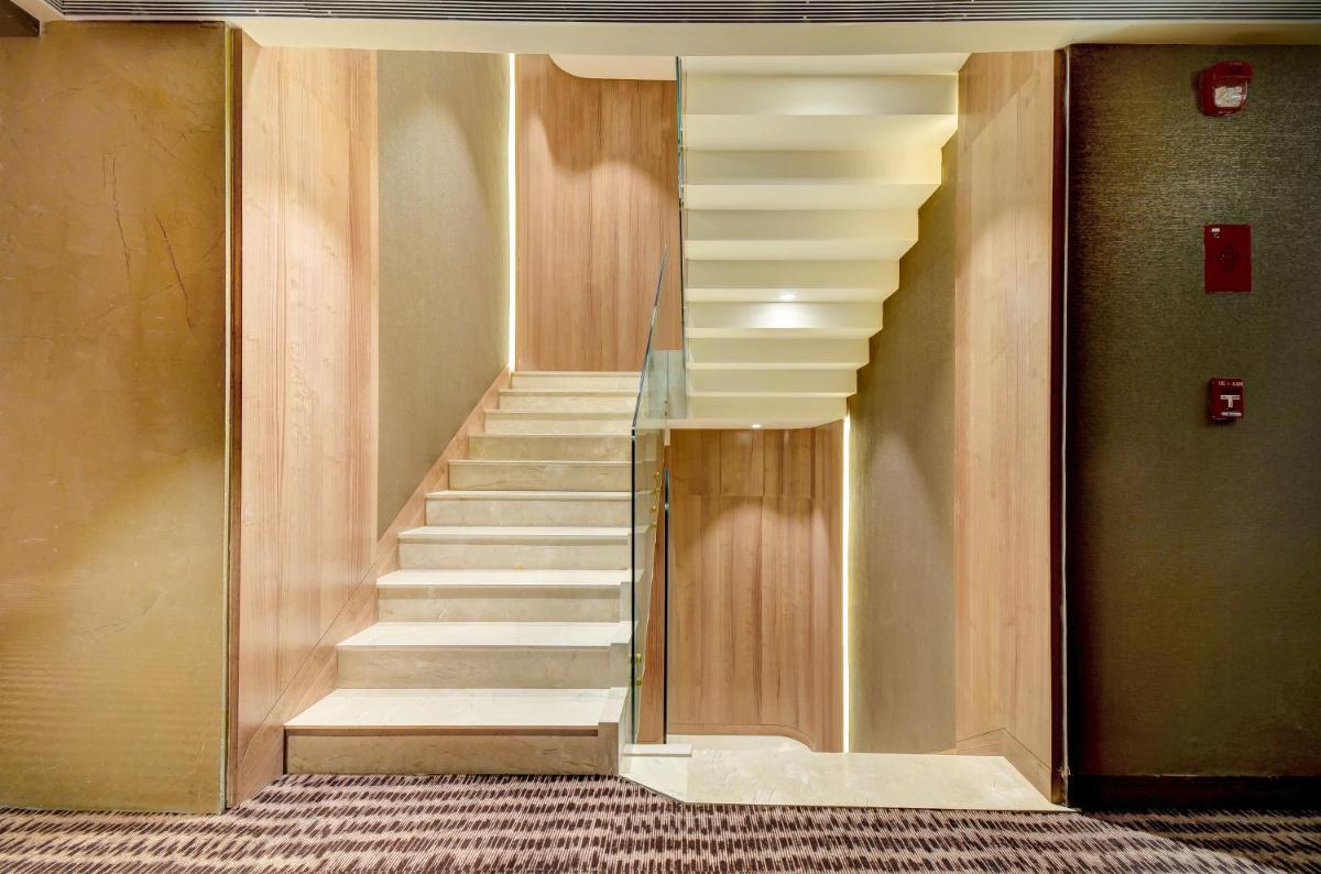 a stairway in a building with white stairs at Vividus in Bengaluru a stairway in a building with white stairs at Vividus in Bengaluru