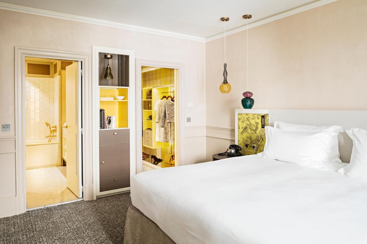 Un ou plusieurs lits dans un hébergement de l'établissement Sofitel Le Scribe Paris Opera