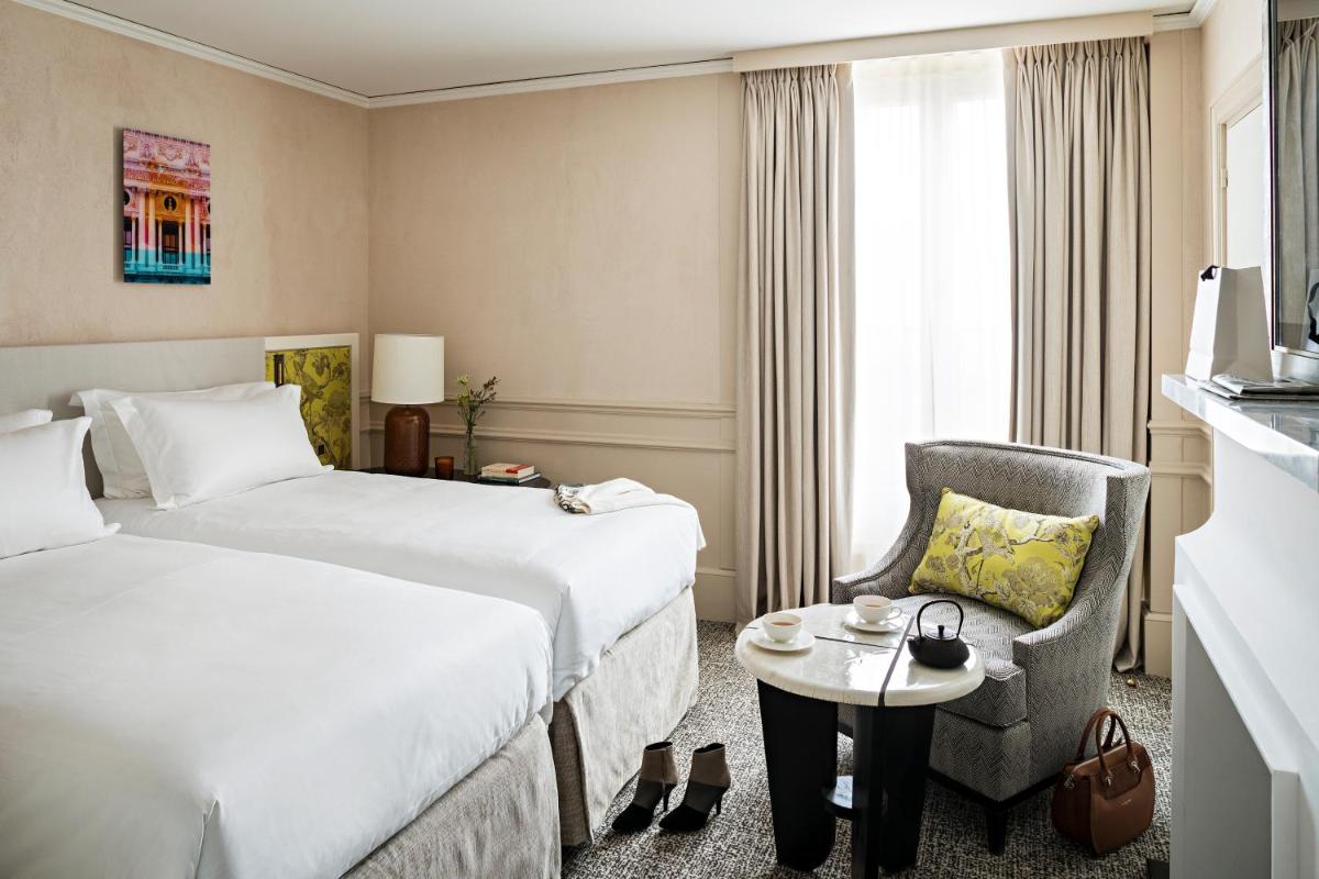 Un ou plusieurs lits dans un hébergement de l'établissement Sofitel Le Scribe Paris Opera