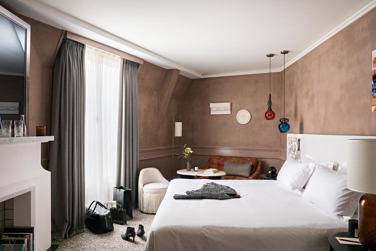 Un ou plusieurs lits dans un hébergement de l'établissement Sofitel Le Scribe Paris Opera