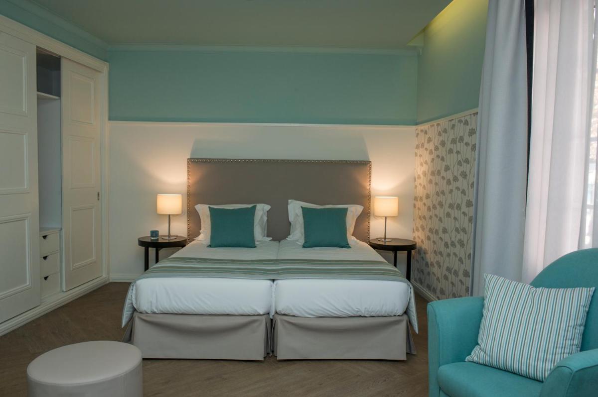 Uma cama ou camas num quarto em Castanheiro Boutique Hotel