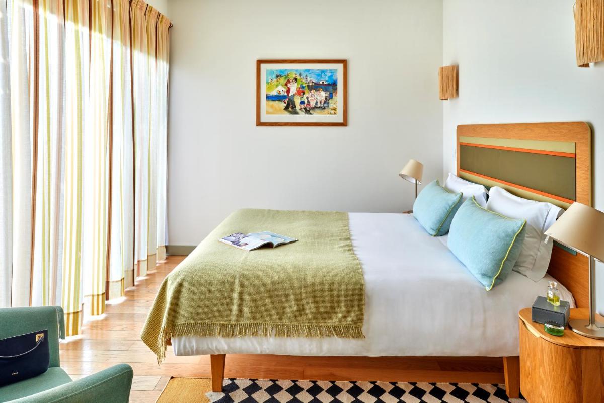 Uma cama ou camas num quarto em Martinhal Sagres Beach Family Resort Hotel