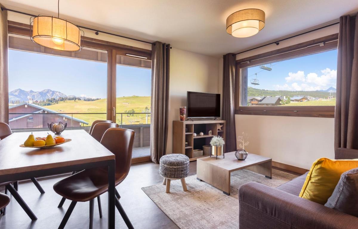 Coin salon dans l'établissement Résidence Club MMV Les Chalets des Cimes