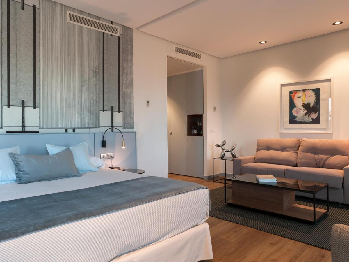 Cama o camas de una habitación en Hotel Neptuno Playa & Spa