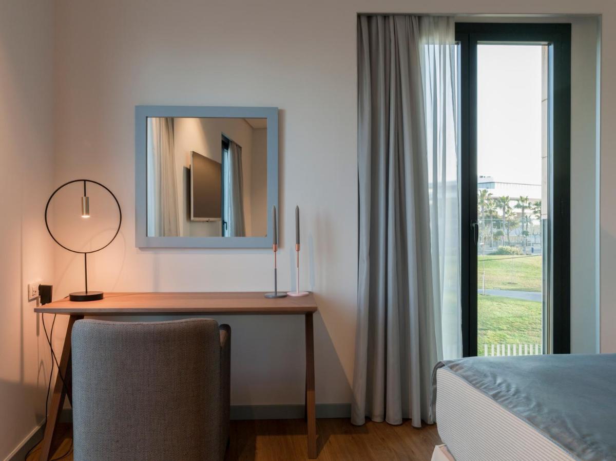 Cama o camas de una habitación en Hotel Neptuno Playa & Spa