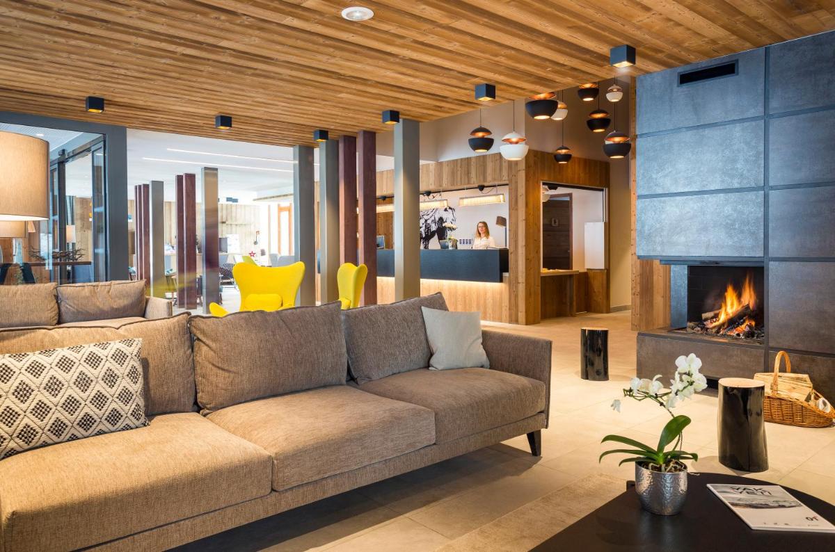 Coin salon dans l'établissement Résidence Club MMV Les Chalets des Cimes