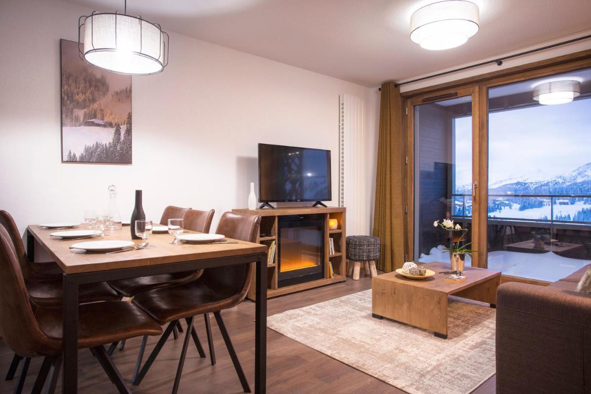 Télévision ou salle de divertissement dans l'établissement Résidence Club MMV Les Chalets des Cimes