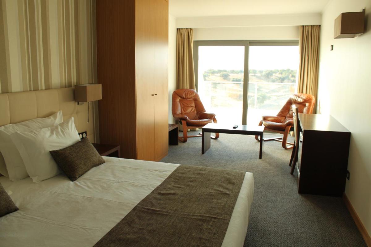 Uma cama ou camas num quarto em Hotel O Gato & Spa