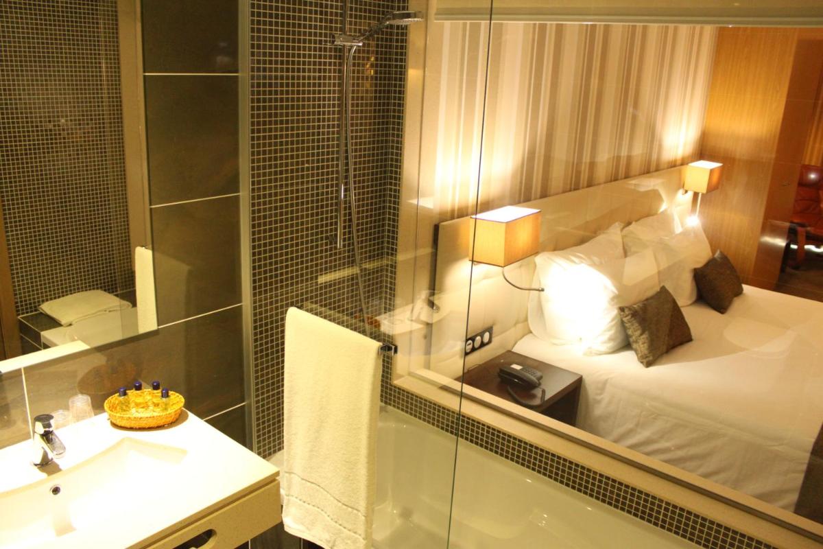 Uma cama ou camas num quarto em Hotel O Gato & Spa