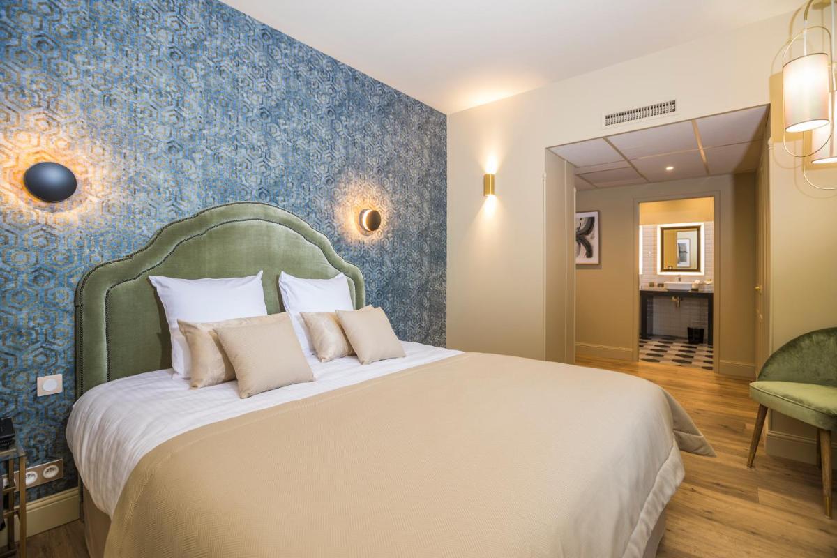 Un ou plusieurs lits dans un hébergement de l'établissement Hotel Clos Castel Villas Spa