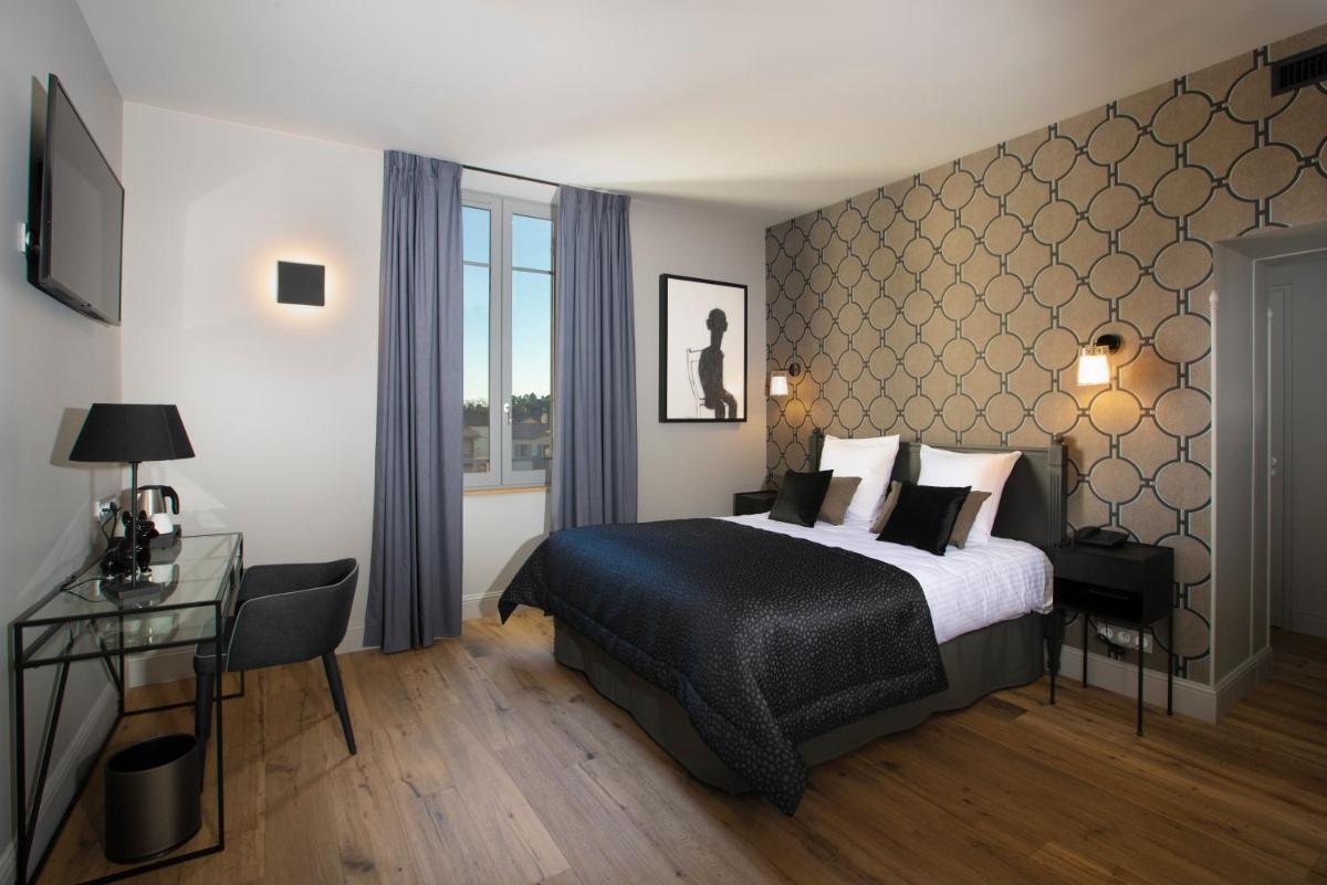 Un ou plusieurs lits dans un hébergement de l'établissement Hotel Clos Castel Villas Spa