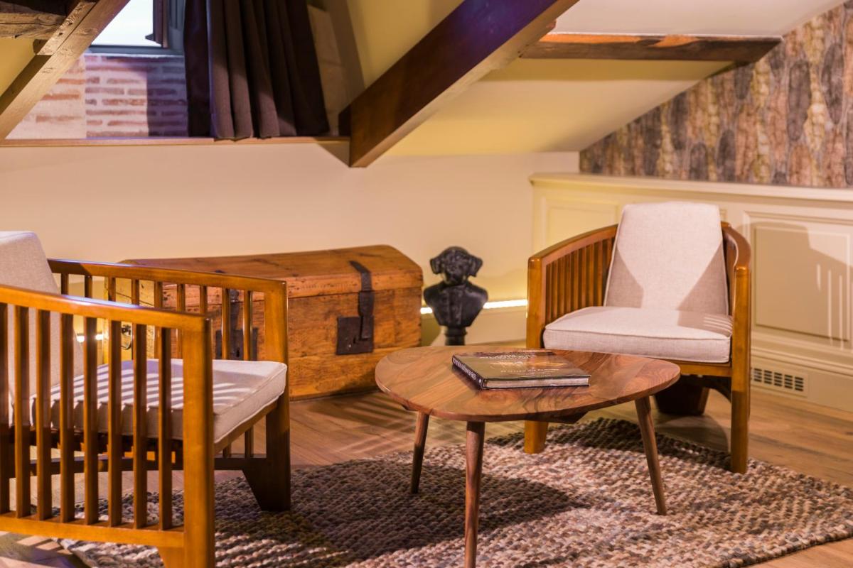 Coin salon dans l'établissement Hotel Clos Castel Villas Spa