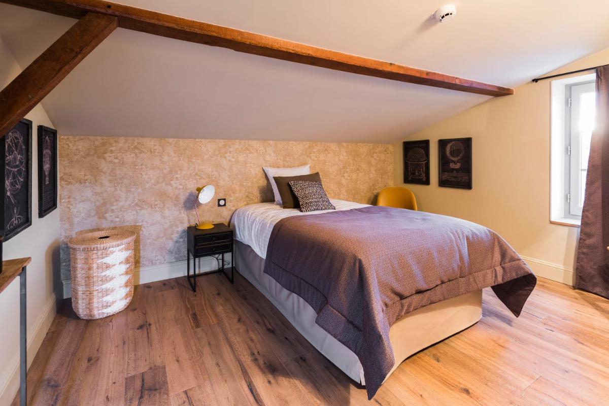 Un ou plusieurs lits dans un hébergement de l'établissement Hotel Clos Castel Villas Spa
