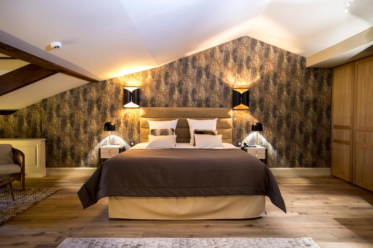 Un ou plusieurs lits dans un hébergement de l'établissement Hotel Clos Castel Villas Spa
