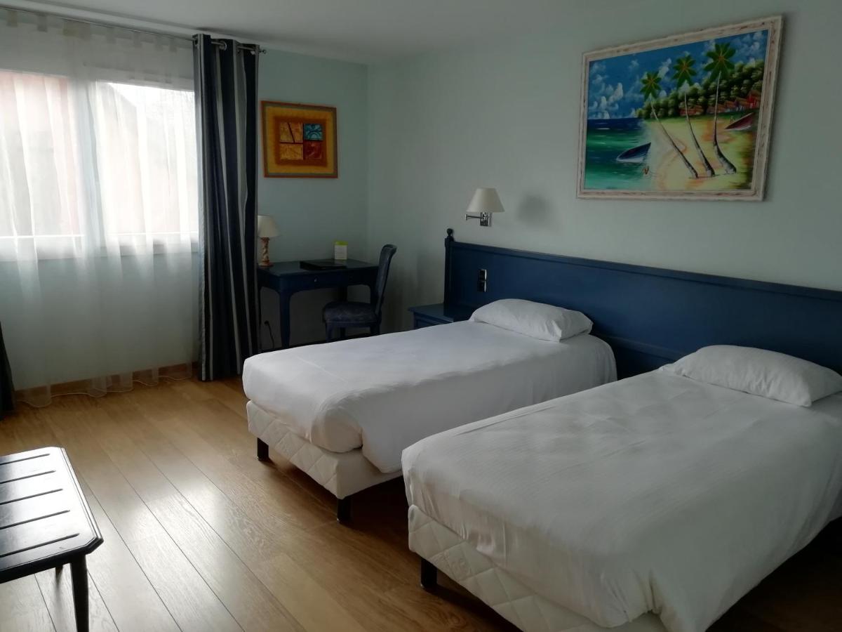 Un ou plusieurs lits dans un hébergement de l'établissement Hotel Blanc