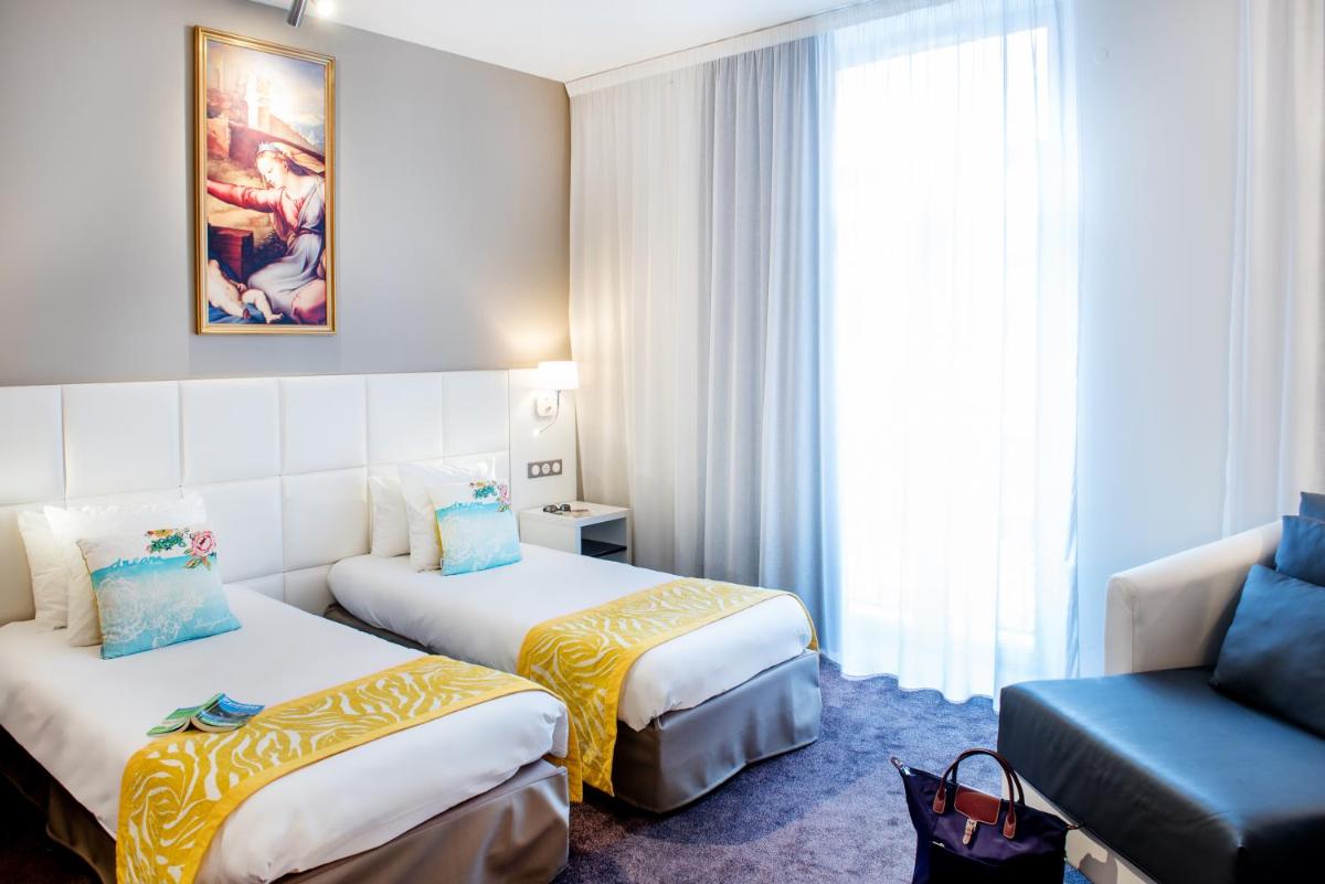Un ou plusieurs lits dans un hébergement de l'établissement Grand Hotel Gallia & Londres