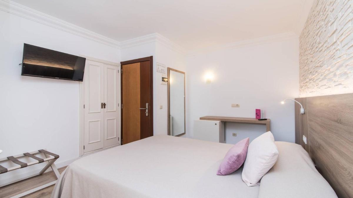 Cama o camas de una habitación en Hotel Na Taconera
