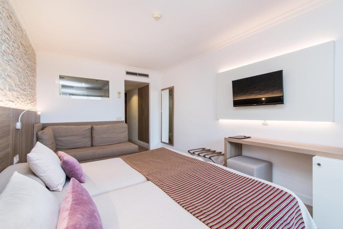 Cama o camas de una habitación en Hotel Na Taconera