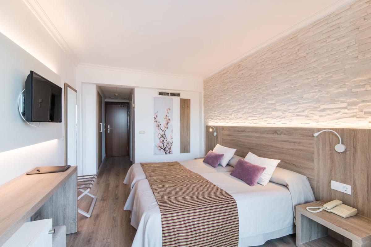 Cama o camas de una habitación en Hotel Na Taconera