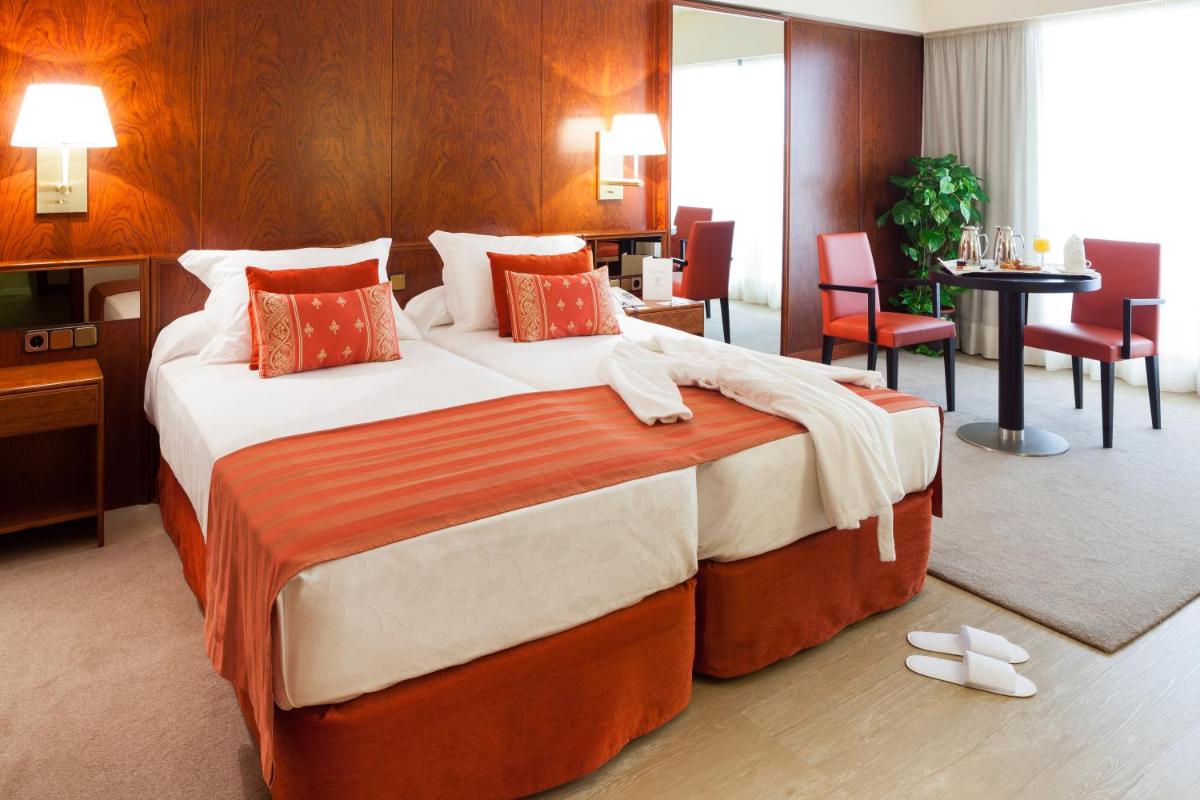 Cama o camas de una habitación en Hotel Royal Plaza