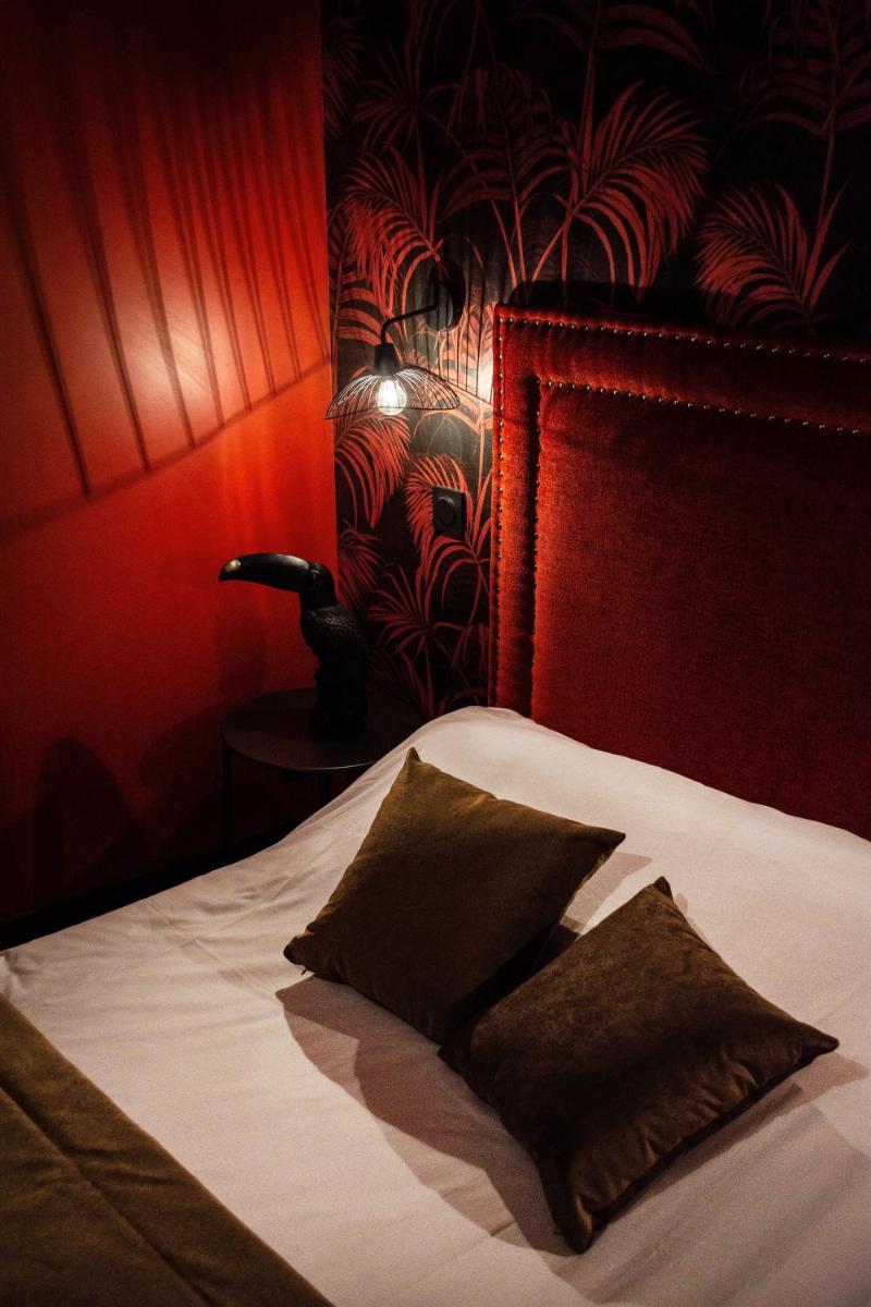 Un ou plusieurs lits dans un hébergement de l'établissement La villa 10 HÔTEL SPA