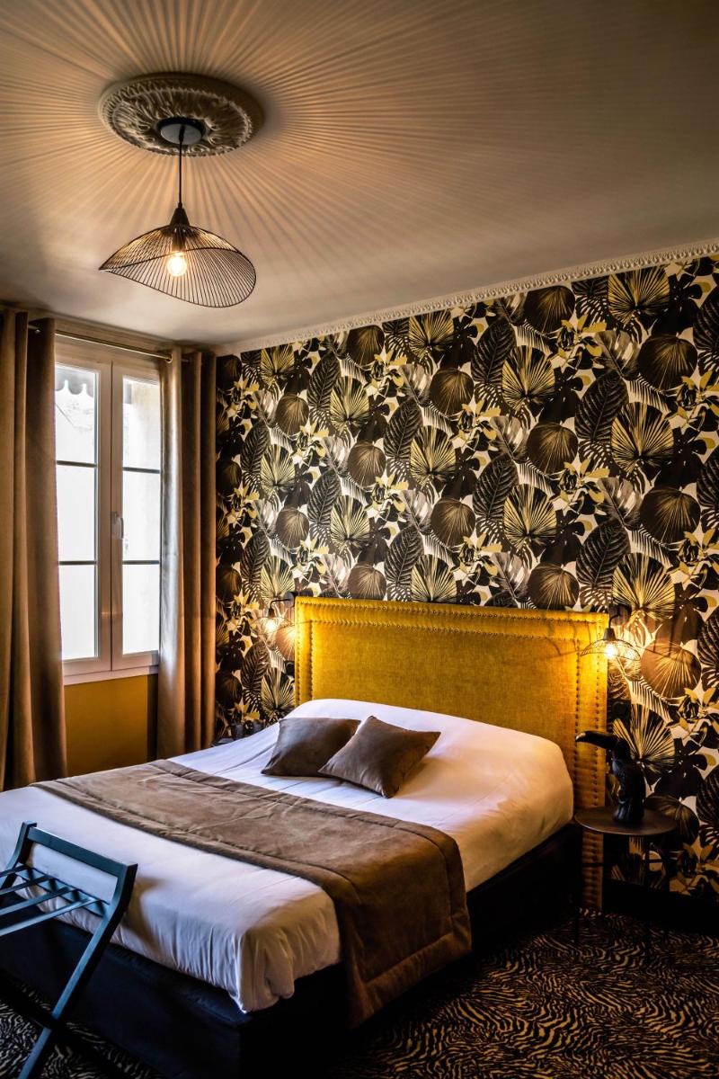 Un ou plusieurs lits dans un hébergement de l'établissement La villa 10 HÔTEL SPA