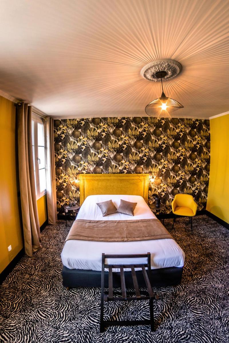 Un ou plusieurs lits dans un hébergement de l'établissement La villa 10 HÔTEL SPA