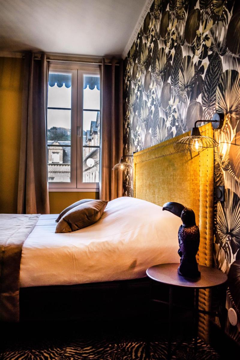 Un ou plusieurs lits dans un hébergement de l'établissement La villa 10 HÔTEL SPA