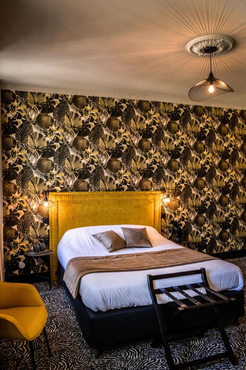 Un ou plusieurs lits dans un hébergement de l'établissement La villa 10 HÔTEL SPA