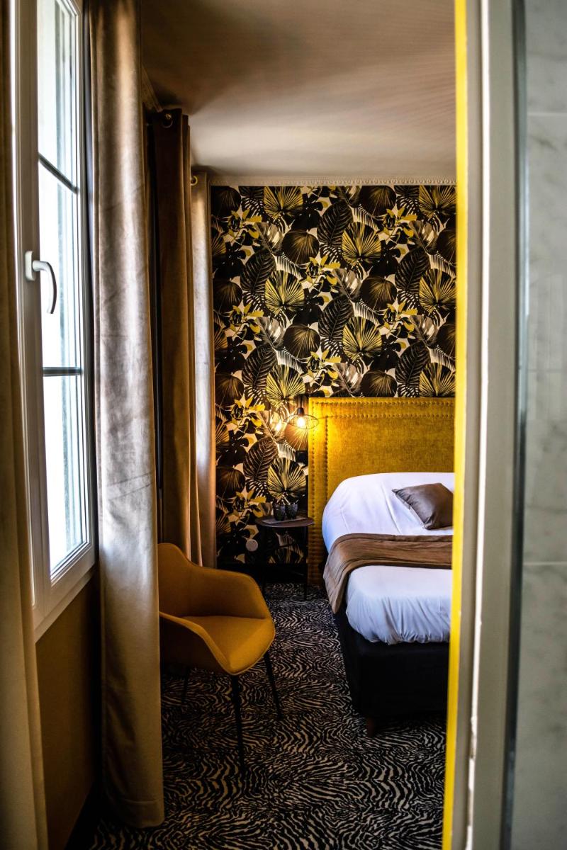 Un ou plusieurs lits dans un hébergement de l'établissement La villa 10 HÔTEL SPA