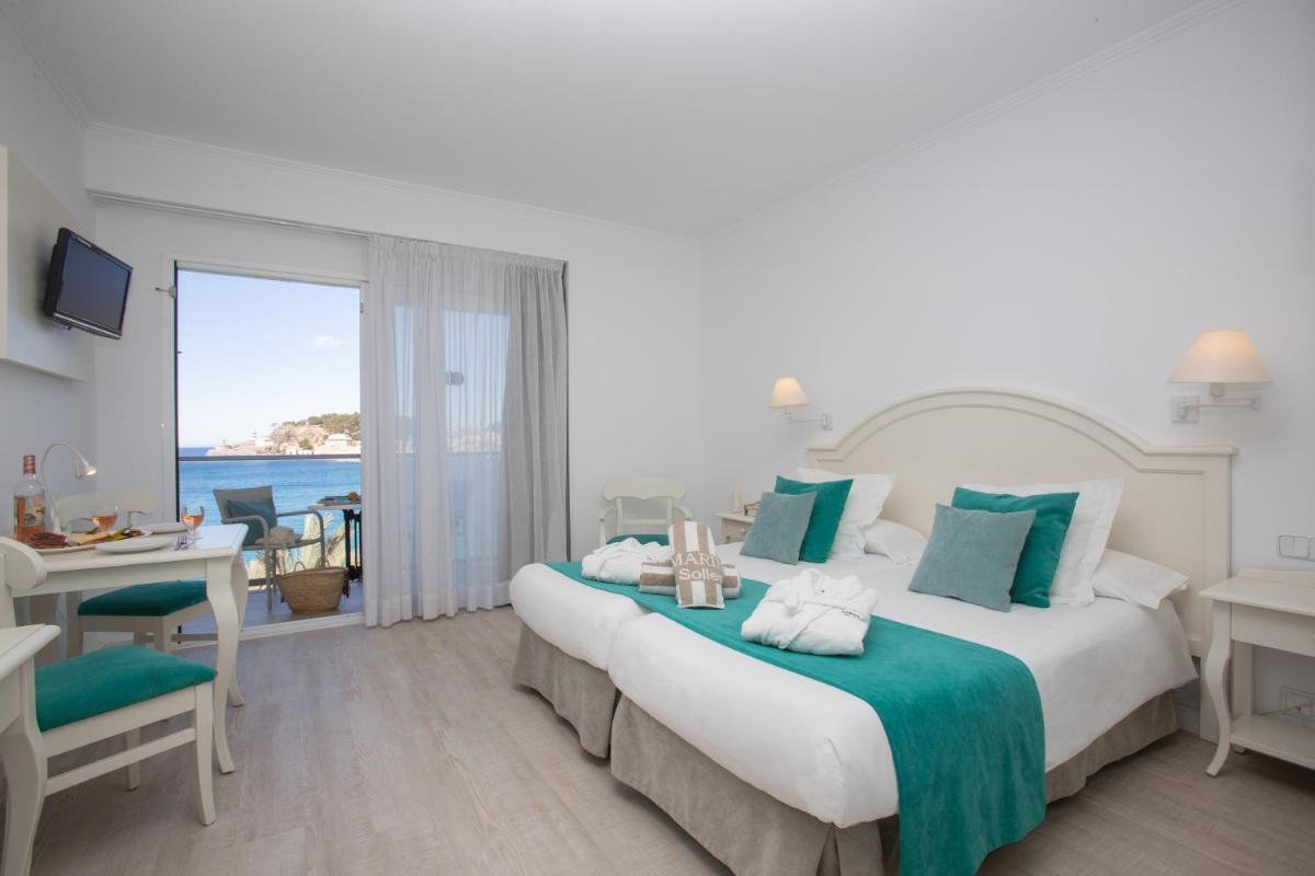 Cama o camas de una habitación en Hotel Marina