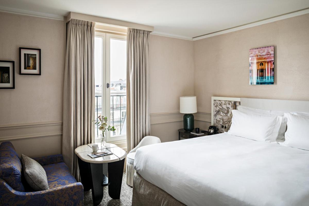 Un ou plusieurs lits dans un hébergement de l'établissement Sofitel Le Scribe Paris Opera