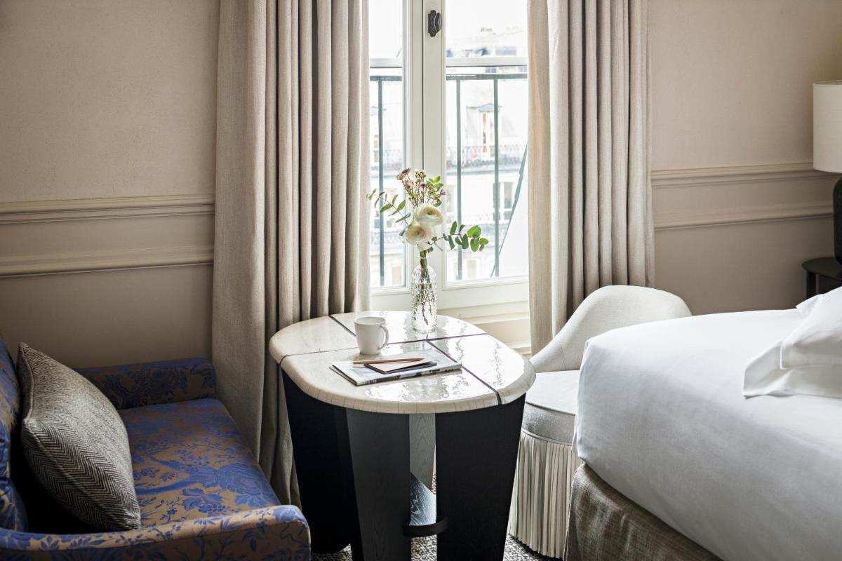 Un ou plusieurs lits dans un hébergement de l'établissement Sofitel Le Scribe Paris Opera