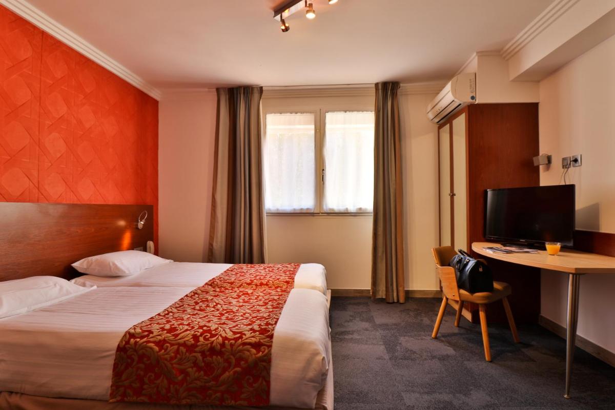 Un ou plusieurs lits dans un hébergement de l'établissement Hotel SPA Plage St Jean