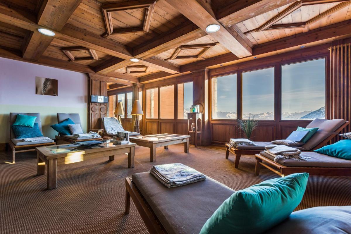 Coin salon dans l'établissement Résidence Pierre & Vacances Premium Les Hauts Bois
