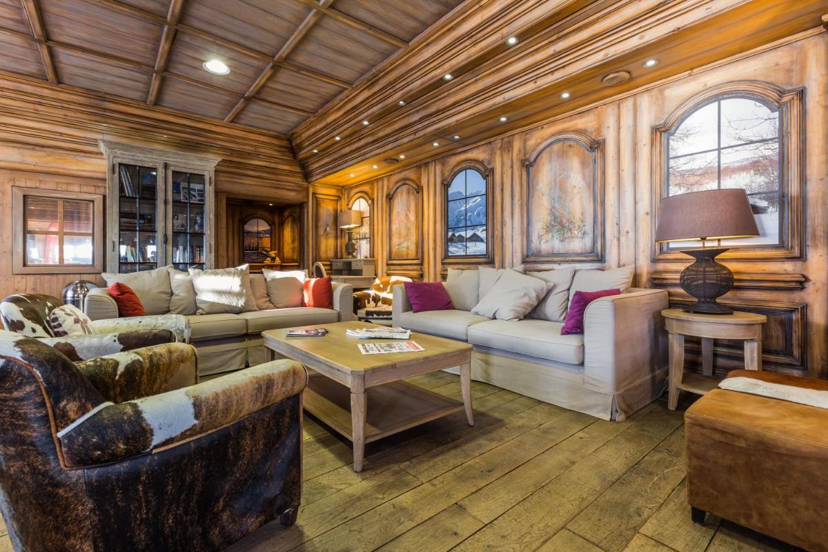Coin salon dans l'établissement Résidence Pierre & Vacances Premium Les Hauts Bois