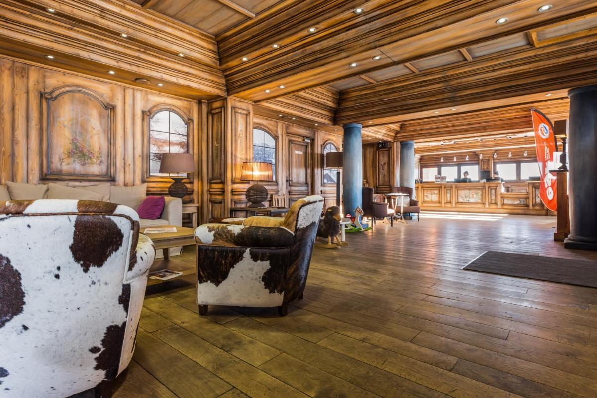 Coin salon dans l'établissement Résidence Pierre & Vacances Premium Les Hauts Bois