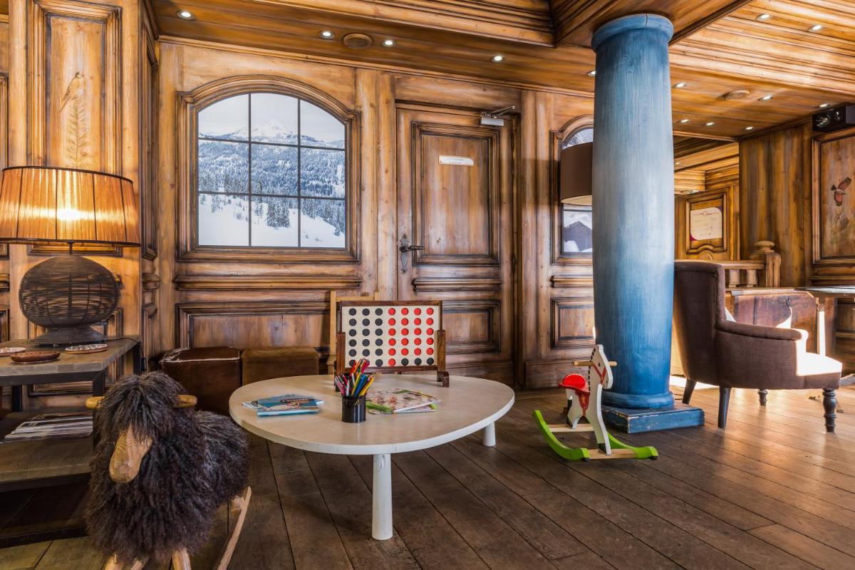 Coin salon dans l'établissement Résidence Pierre & Vacances Premium Les Hauts Bois