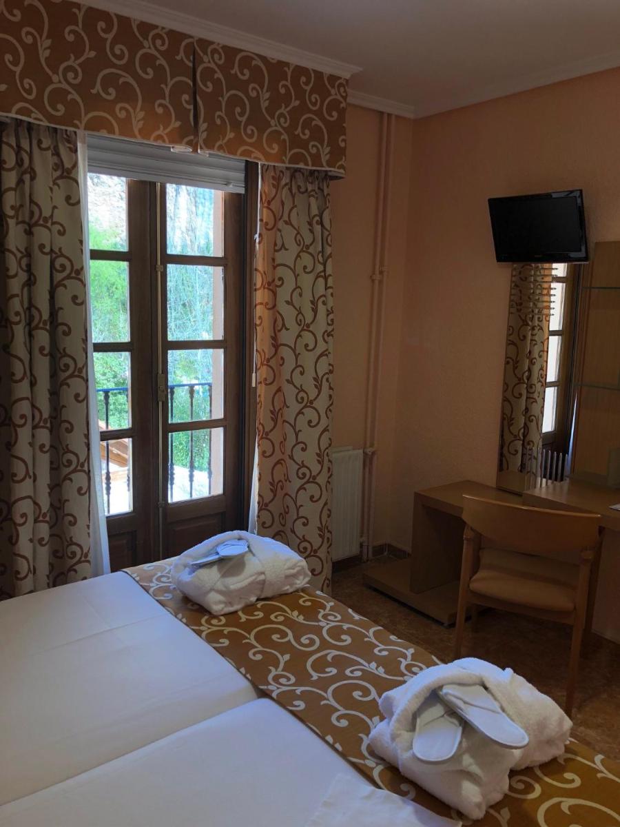 Cama o camas de una habitación en Hotel Balneario de La Virgen