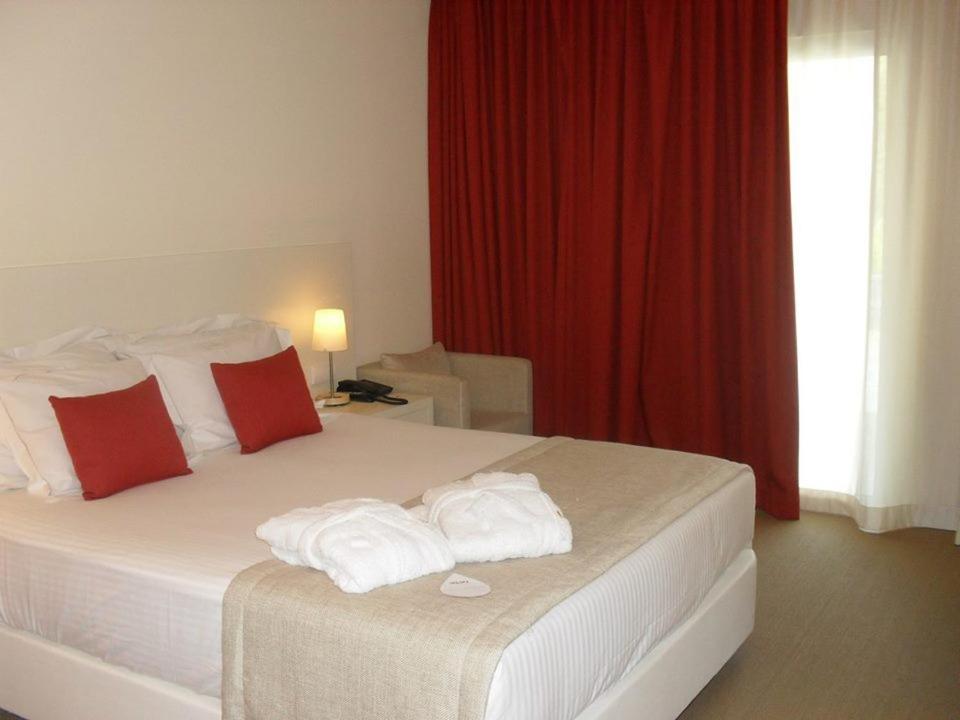 Uma cama ou camas num quarto em INLIMA Hotel & Spa