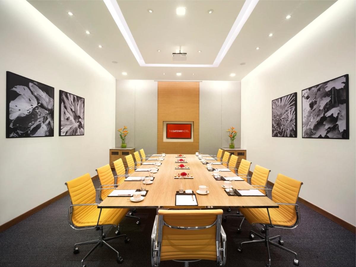 a large conference room with a long table and chairs at Vivanta Kolkata EM Bypass in Kolkata