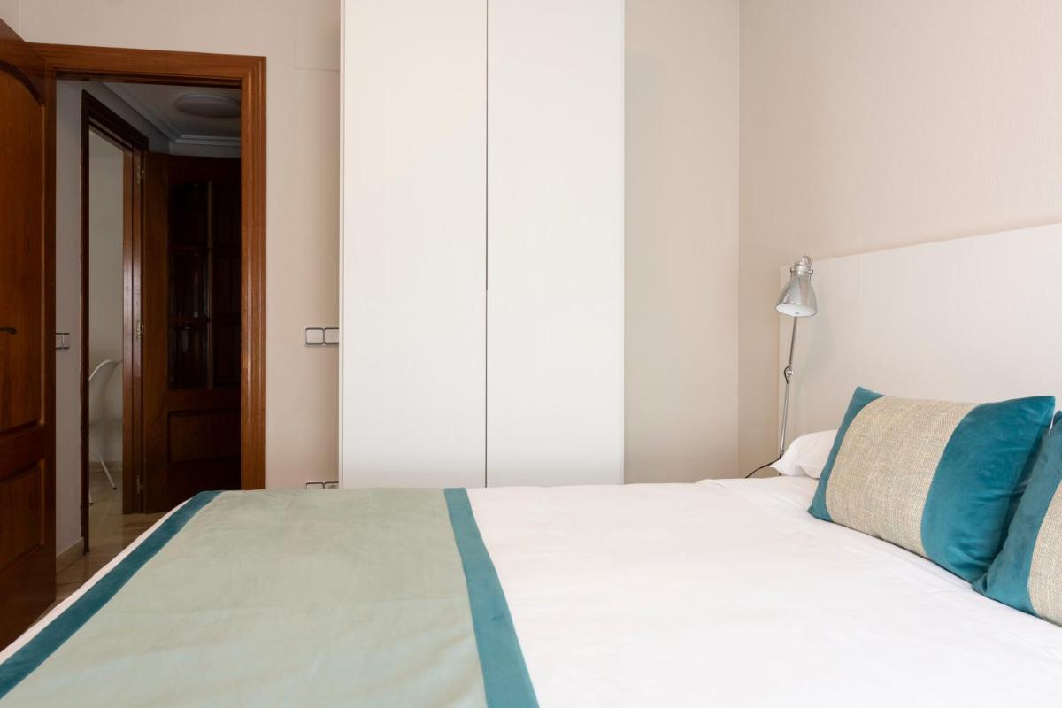 Cama o camas de una habitación en Aparthotel Los Girasoles