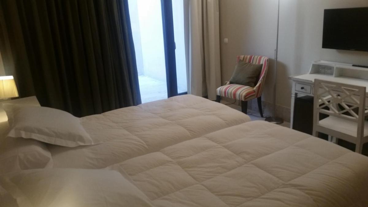 Cama o camas de una habitación en Hotel Palacio de Mengibar