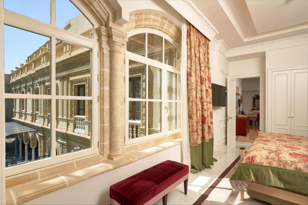 Cama o camas de una habitación en Hotel Casa Palacio María Luisa