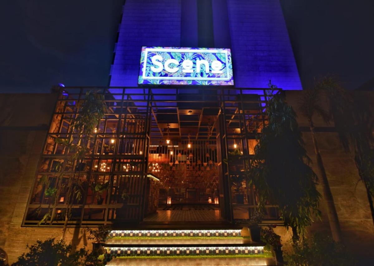 a sign on the side of a building at night at Radisson Blu Jaipur in Jaipur