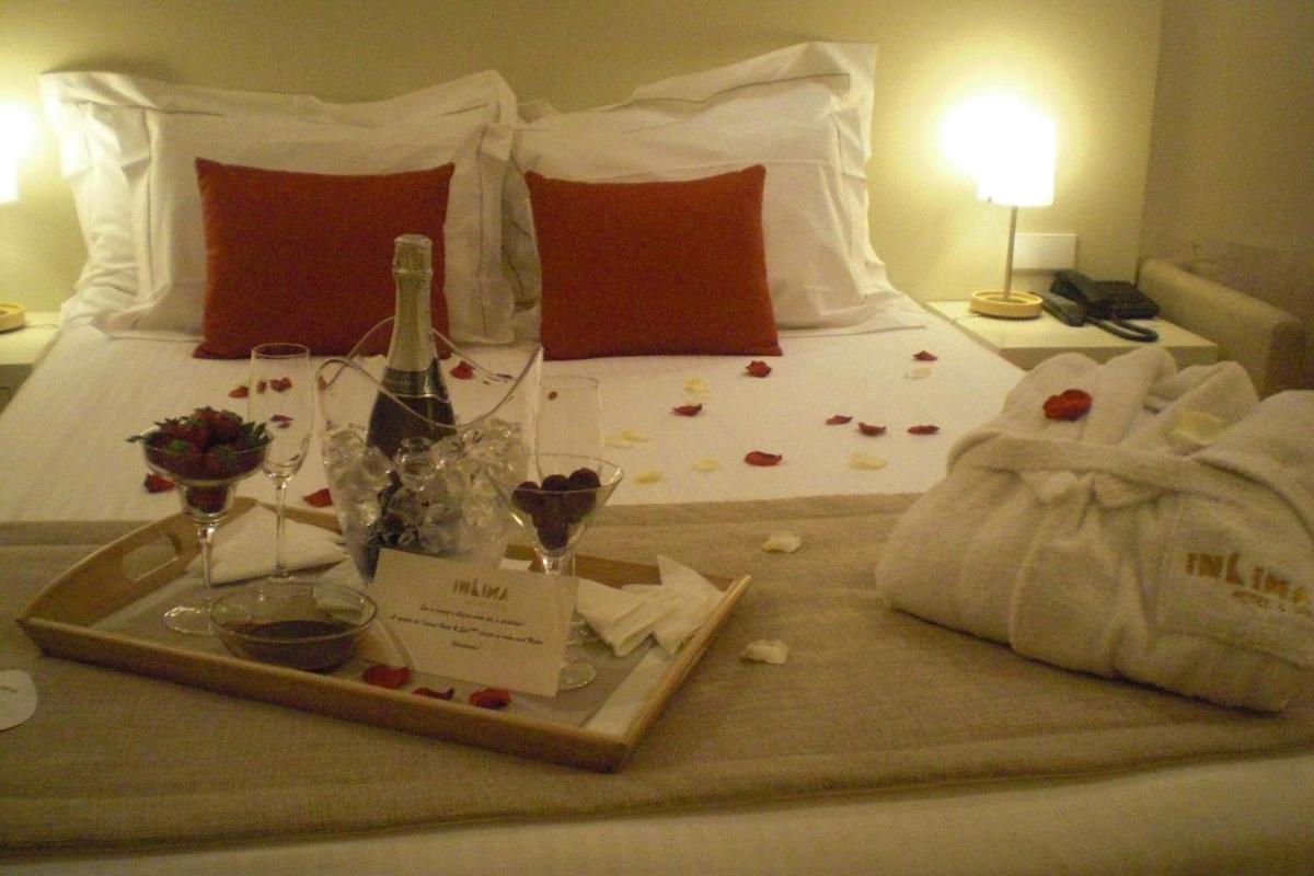 Uma cama ou camas num quarto em INLIMA Hotel & Spa