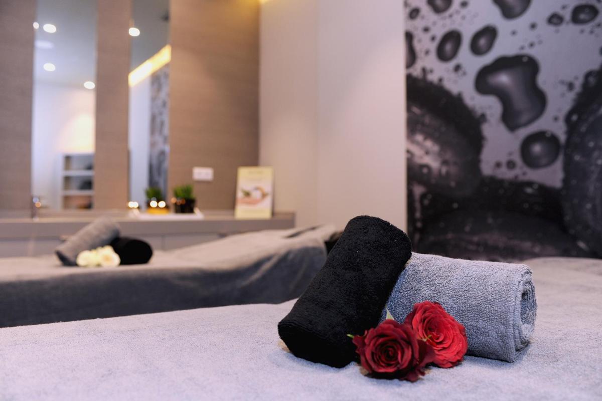 Uma cama ou camas num quarto em Enotel Magnólia