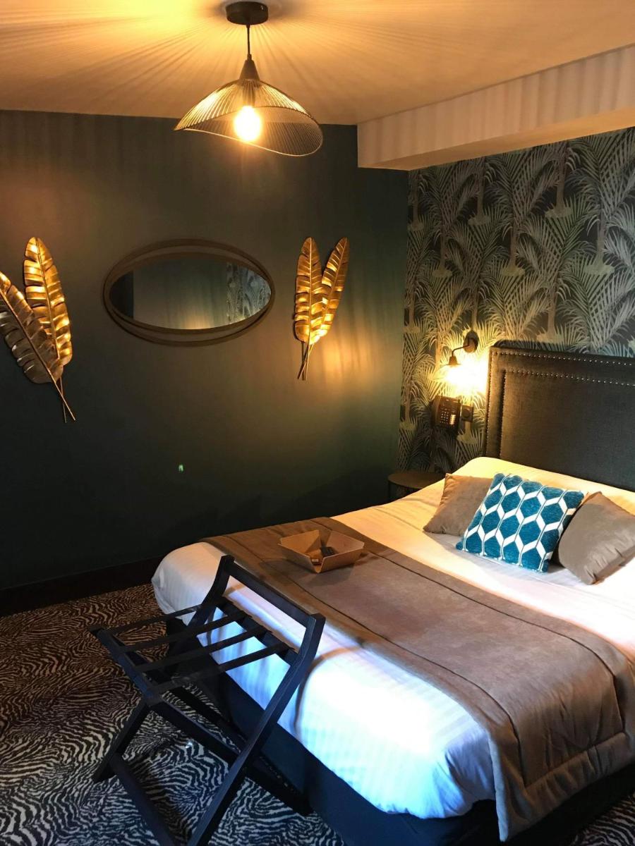 Un ou plusieurs lits dans un hébergement de l'établissement La villa 10 HÔTEL SPA