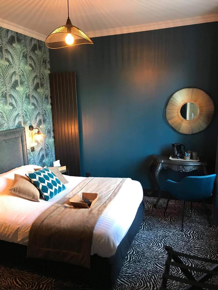 Un ou plusieurs lits dans un hébergement de l'établissement La villa 10 HÔTEL SPA