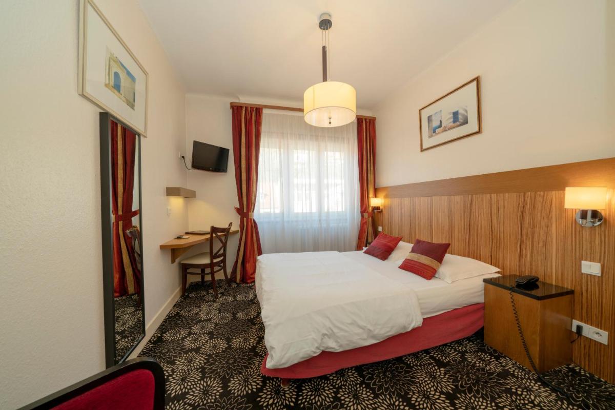 Un ou plusieurs lits dans un hébergement de l'établissement Hôtel du Parc, Restaurant, Spa & Wellness